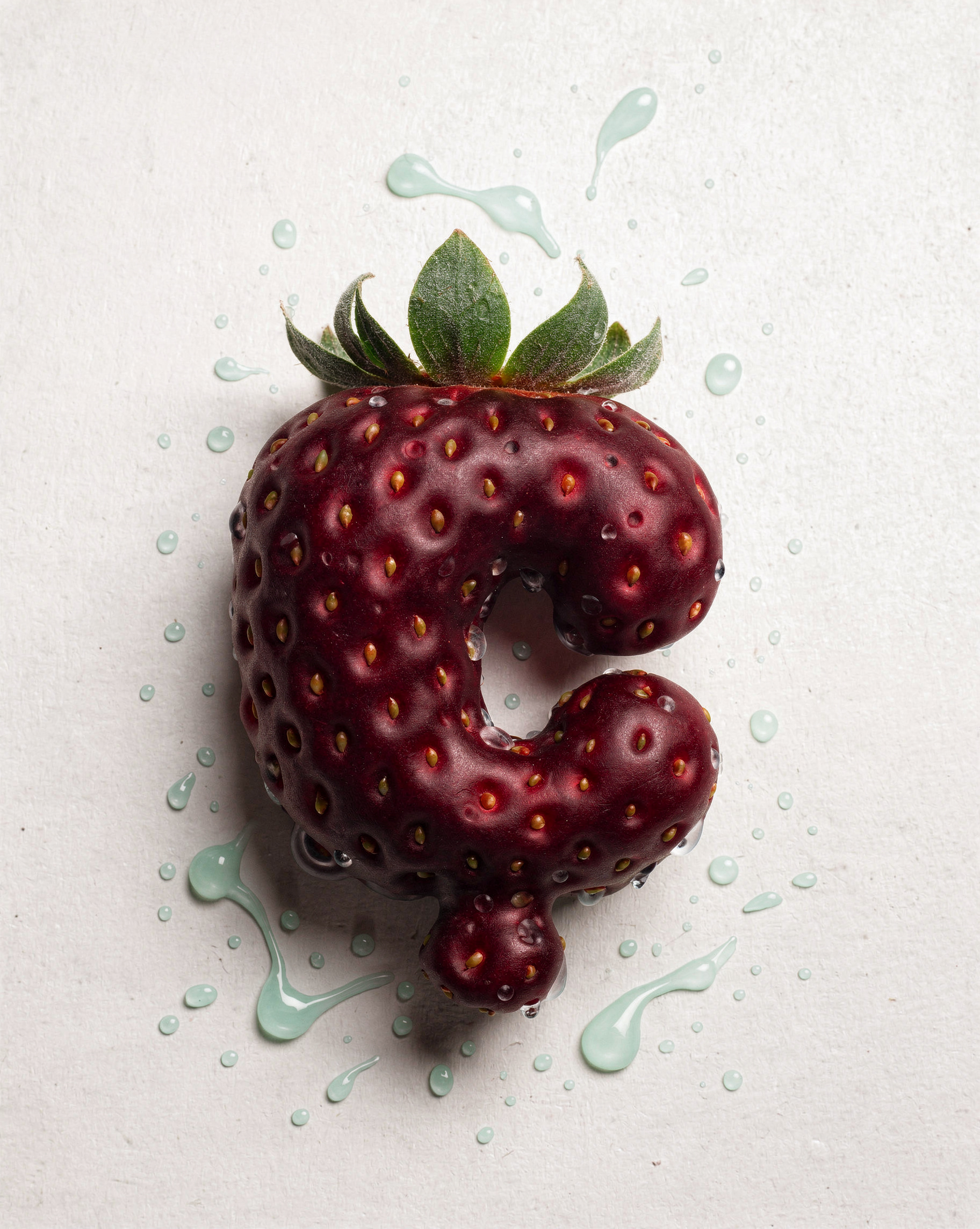 C-Shaped Strawberry With Mint Splash Droplets