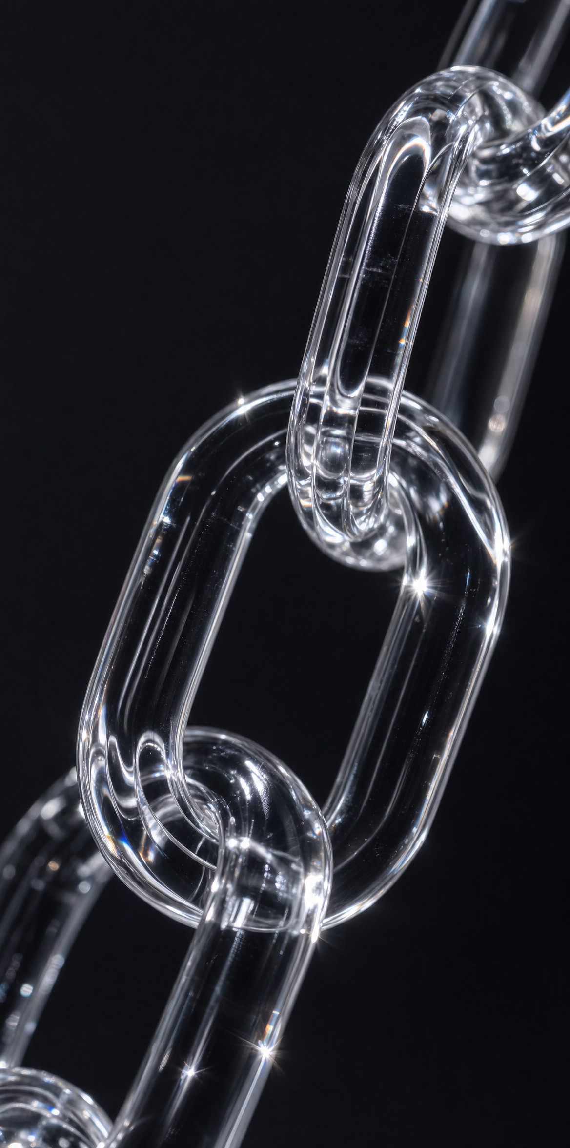 Clear acrylic interlocking chain links, charcoal black background