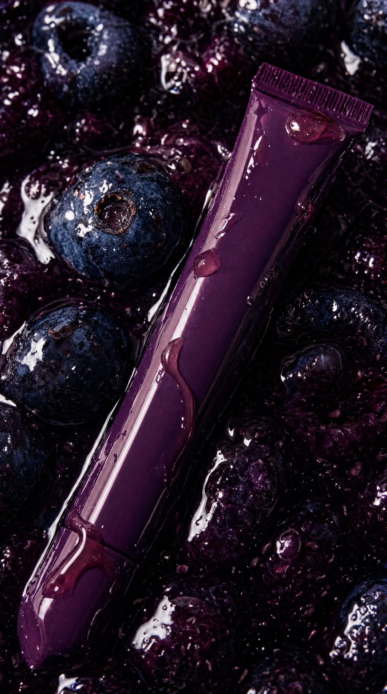 Deep berry lip tint tube in blueberry gel