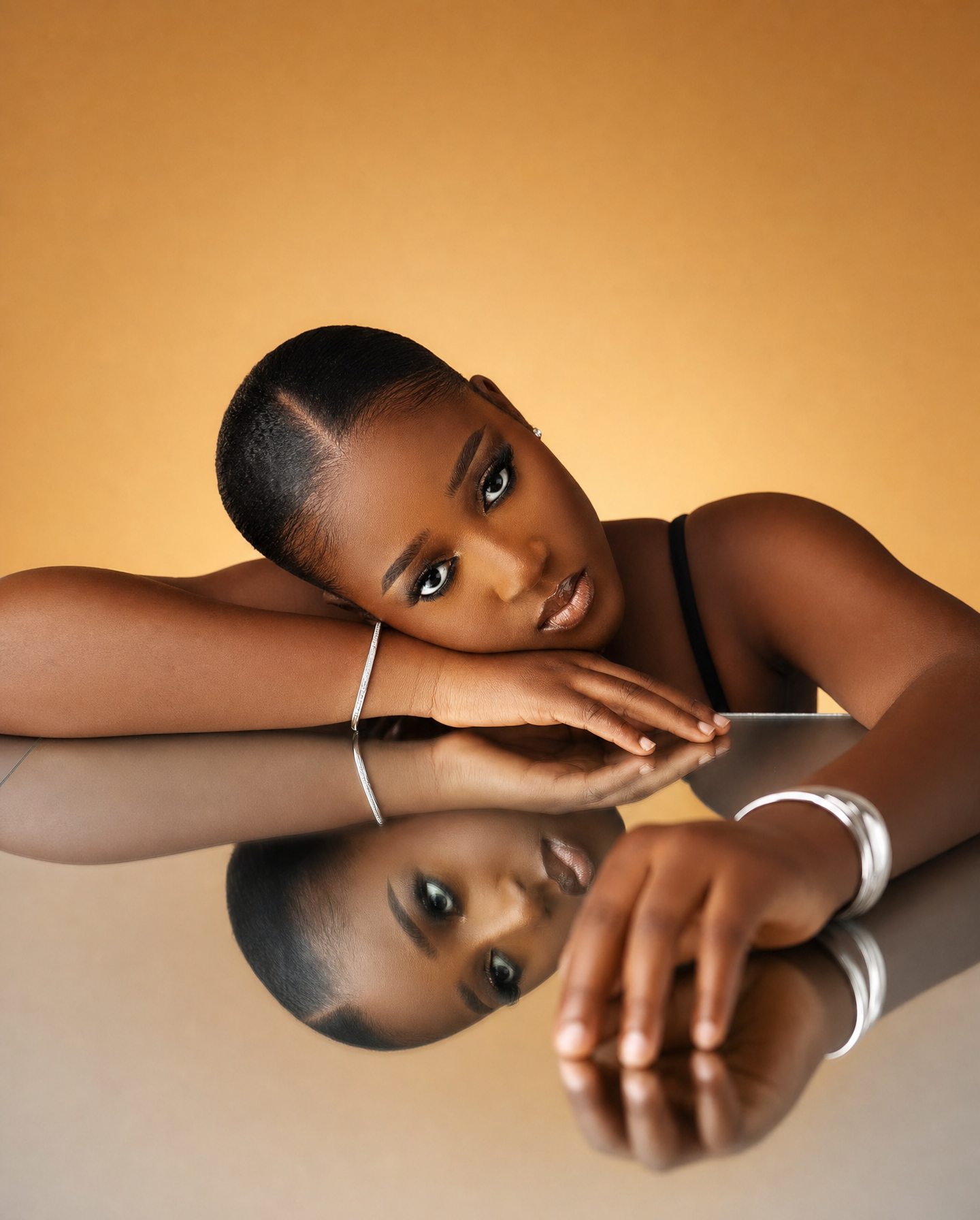 Elegant beauty portrait on reflective silver