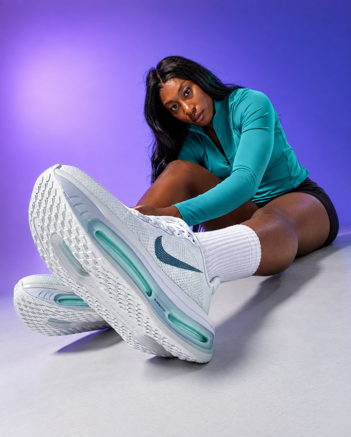 Fit Black Woman in Teal Athletic Top, Teal-Accented Sneakers