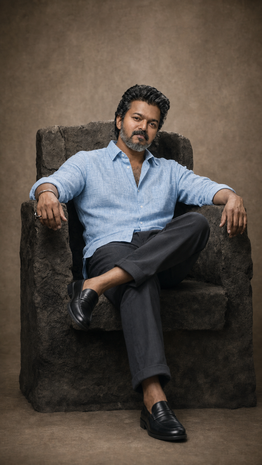 Middle-aged man in blue linen shirt, taupe studio