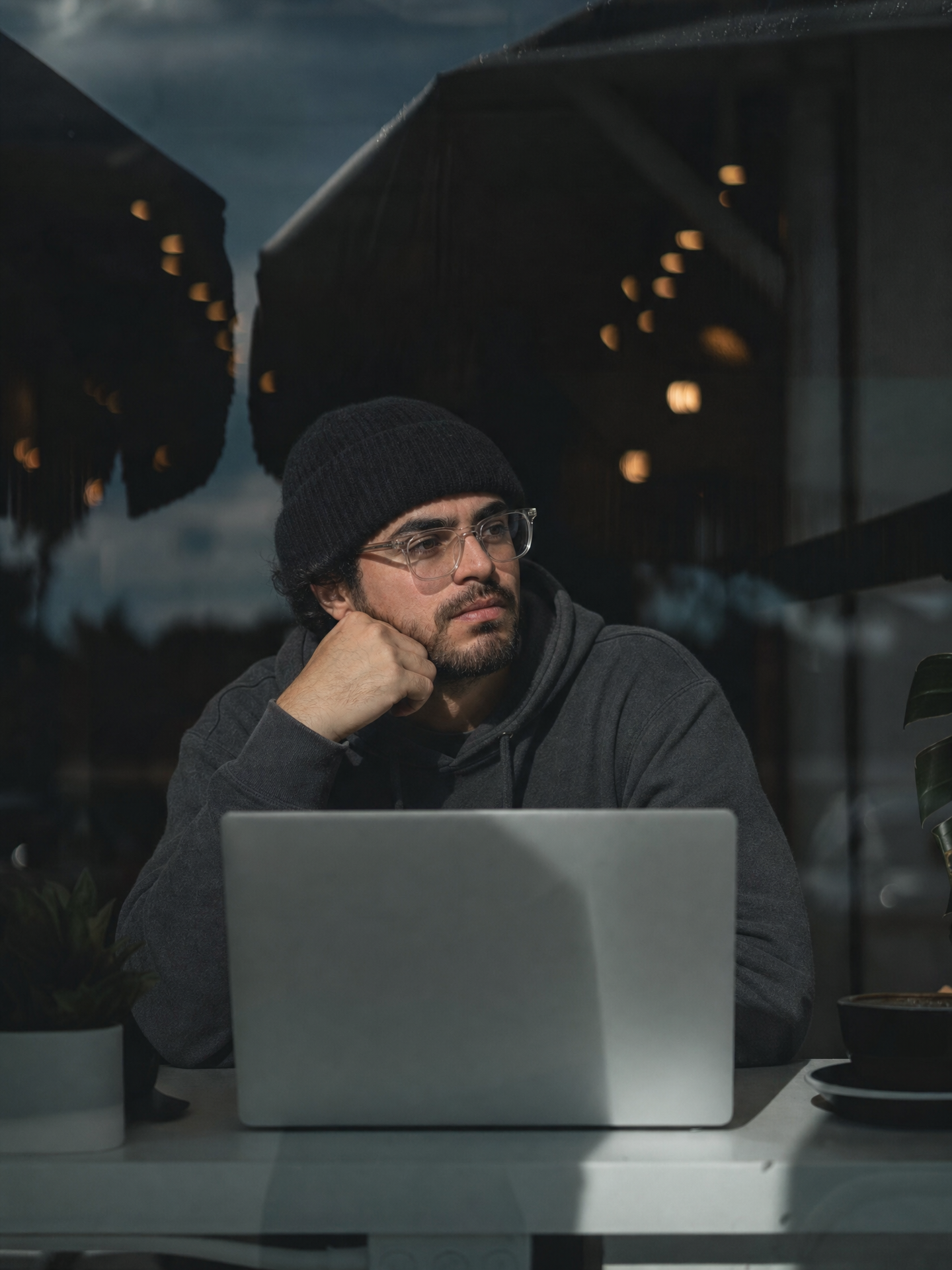 Moody cafe portrait with laptop