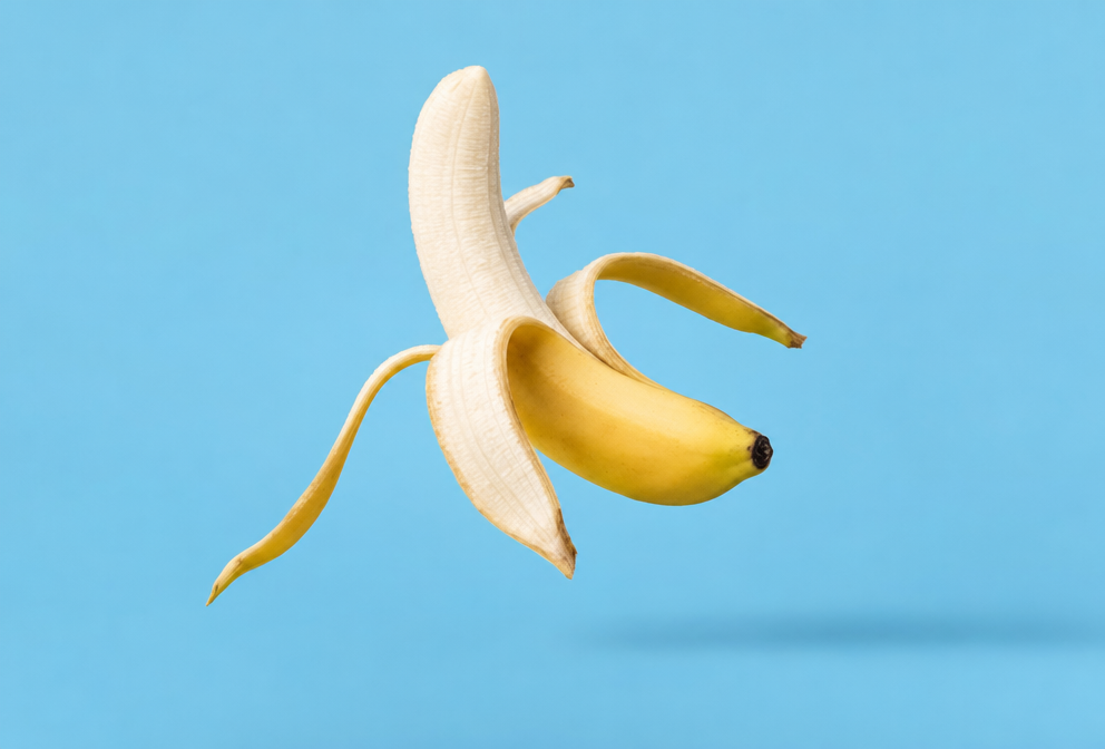 Partially Peeled Banana on Blue