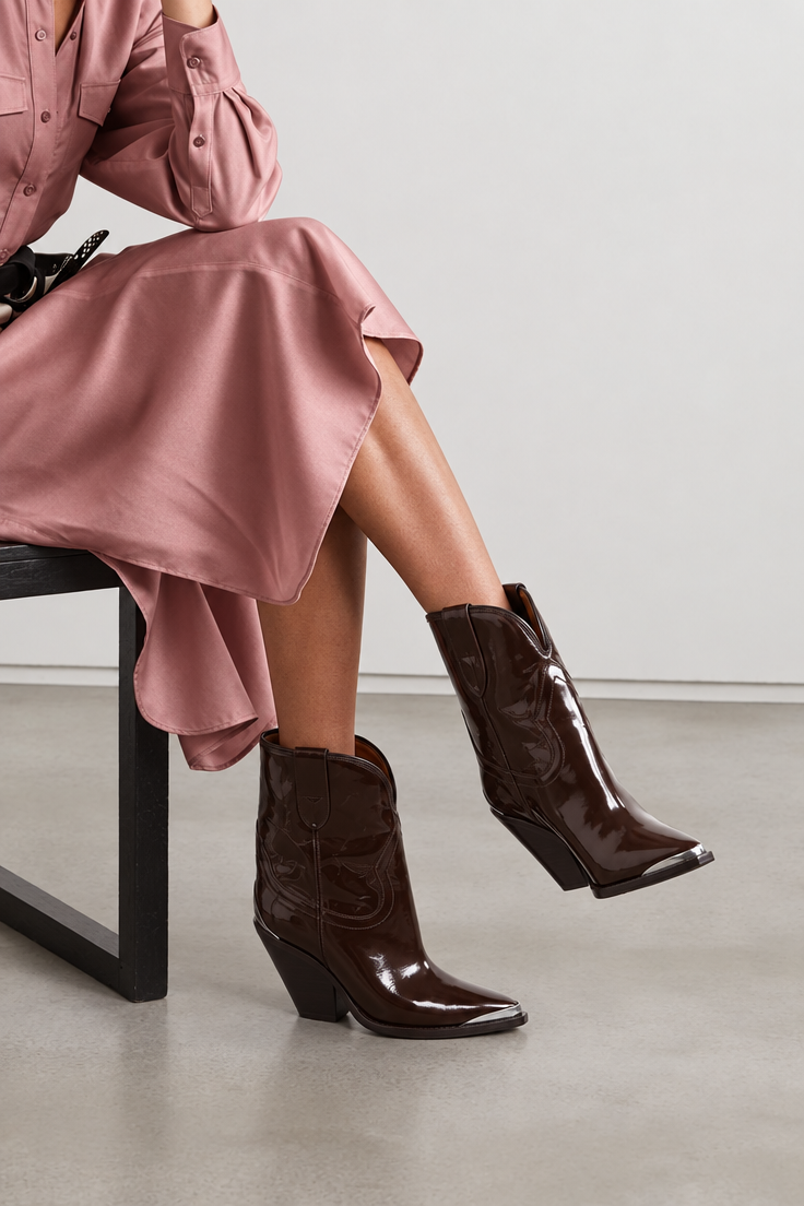 Seated model in dusty rose satin midi dress