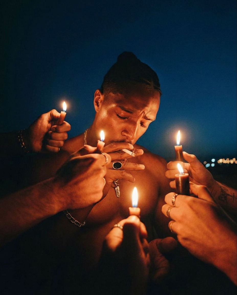 Shirtless Man With Hands Holding Amber Candles