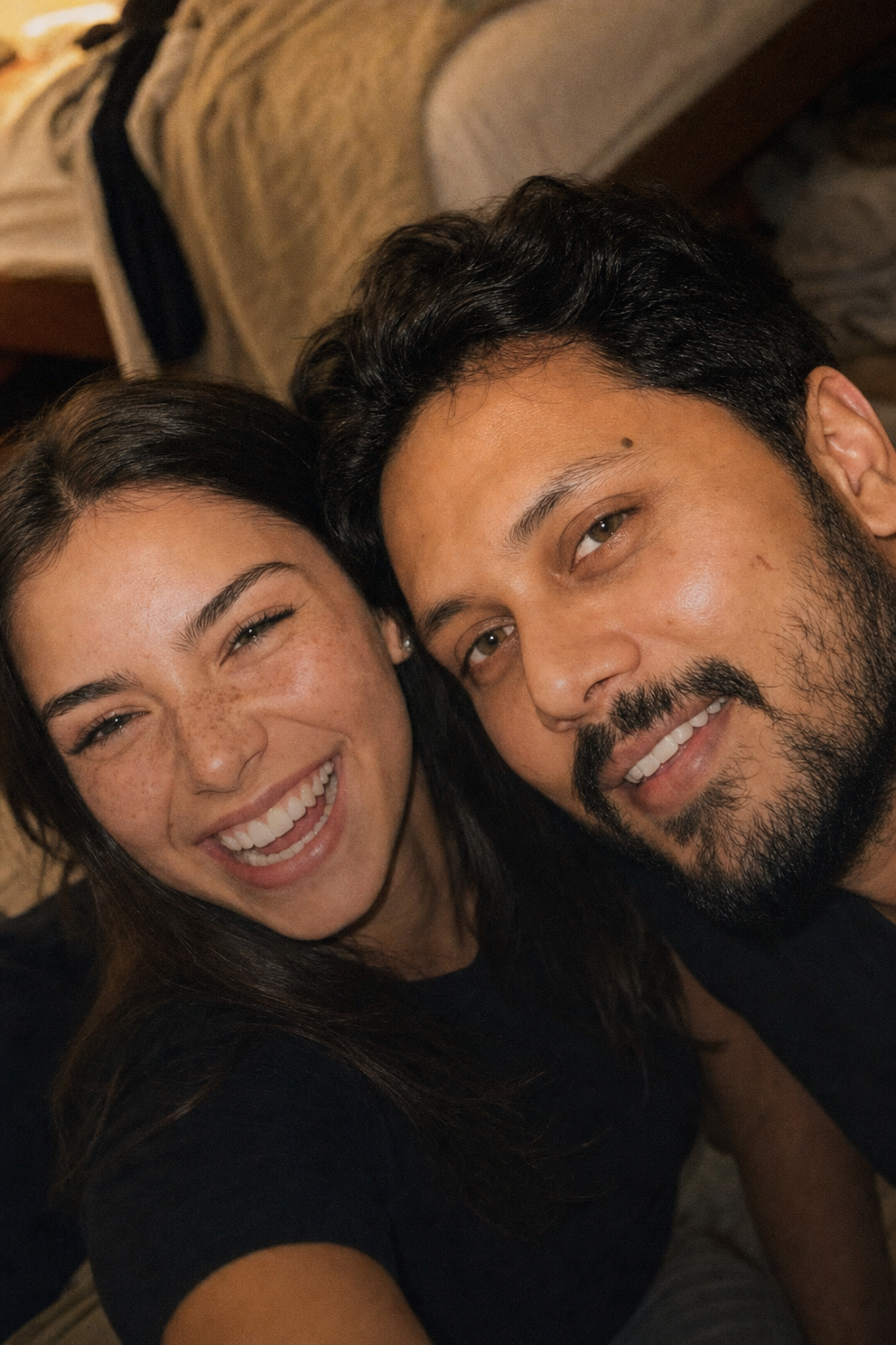 Warm indoor flashless couple selfie