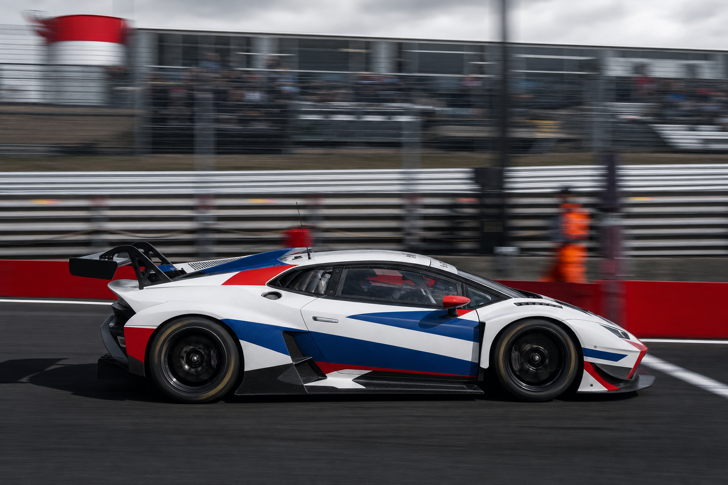 White-blue-red GT3 in pit lane