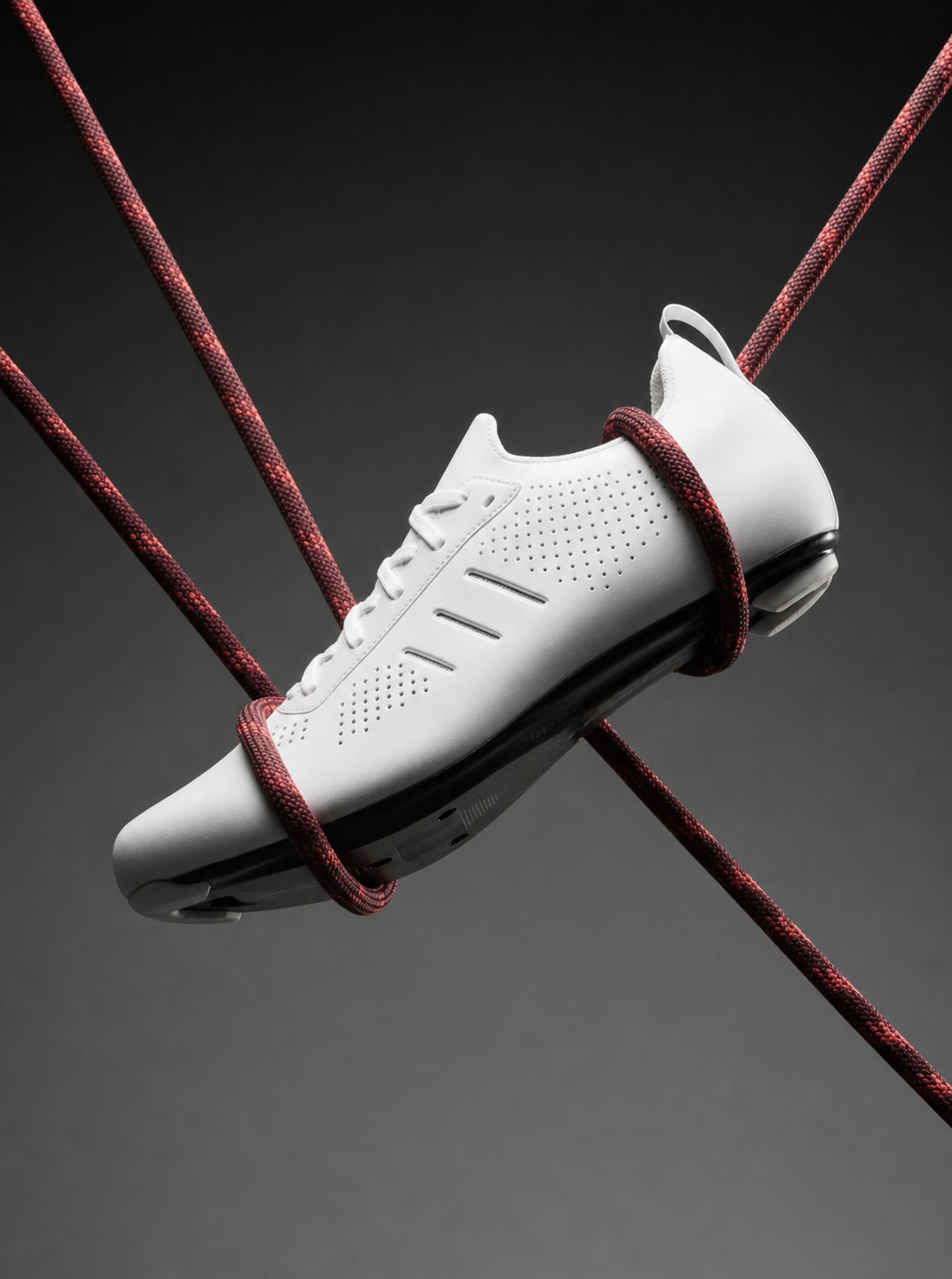 Crimson-Bound Athletic Shoe in Suspension