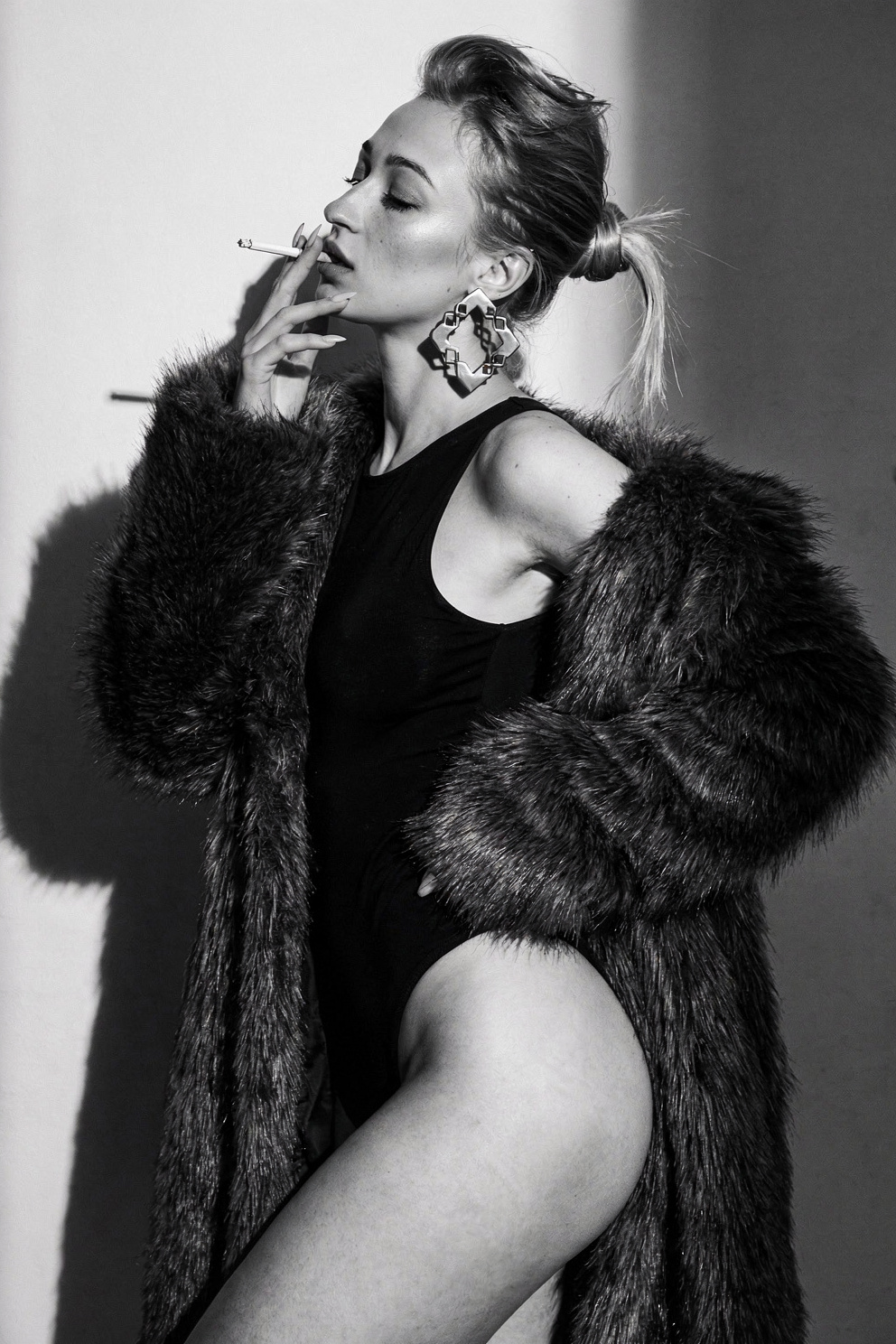 Woman in black bodysuit with shaggy fur coat — flux-2-pro
