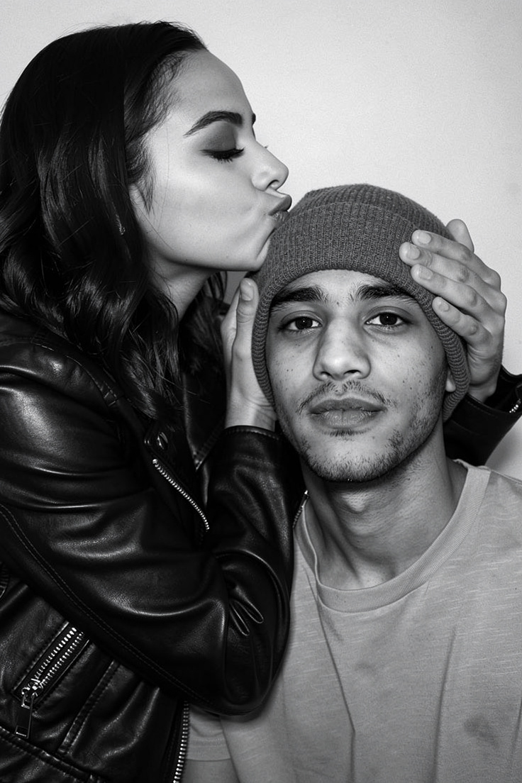 Woman Kissing Man's Forehead Tenderly