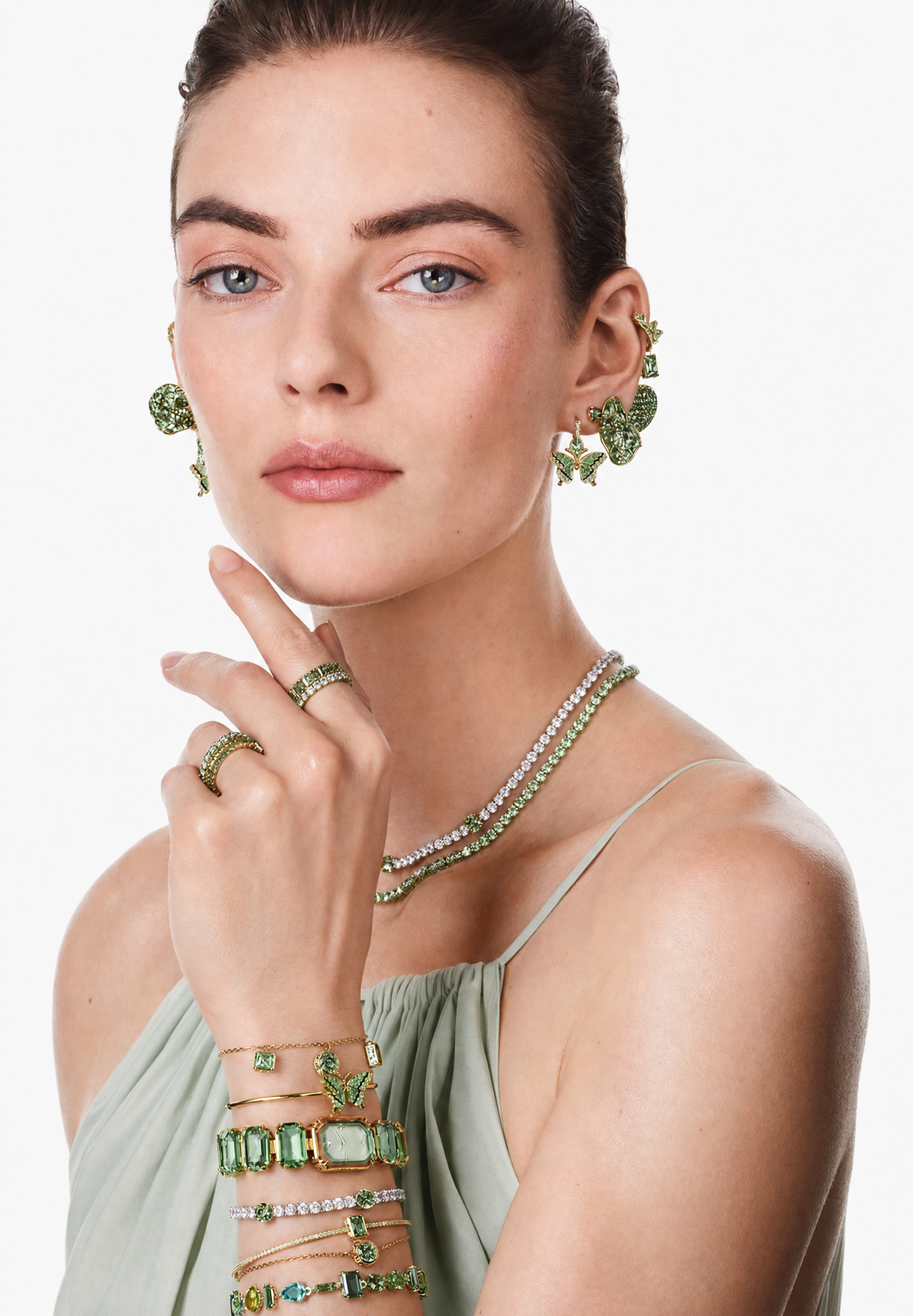Young woman with green gemstone jewelry